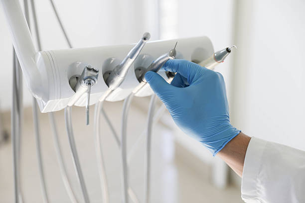 Professional Tooth Extraction technician working in Hudson, MI